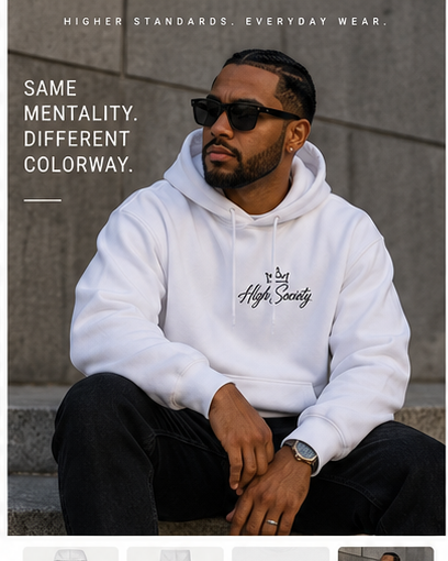 Male model wearing a light High Society premium hoodie in an urban setting